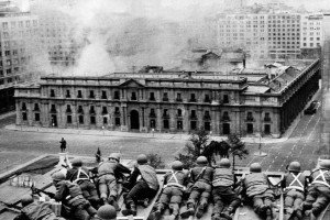 Chilean Army troops positioned on a rooftop fire on the La Moneda Palace 11 September 1973 in Santiago, during the military coup led by General Augusto Pinochet which overthrew Chilean constitutional president Salvador Allende, who died in the attack on the palace. Next 10 December 2007 marks the first anniversary of Pinochet's decease at the Military Hospital in Santiago, where he had been admitted a week before following a heart attack. AFP PHOTO (Photo credit should read OFF/AFP/Getty Images)