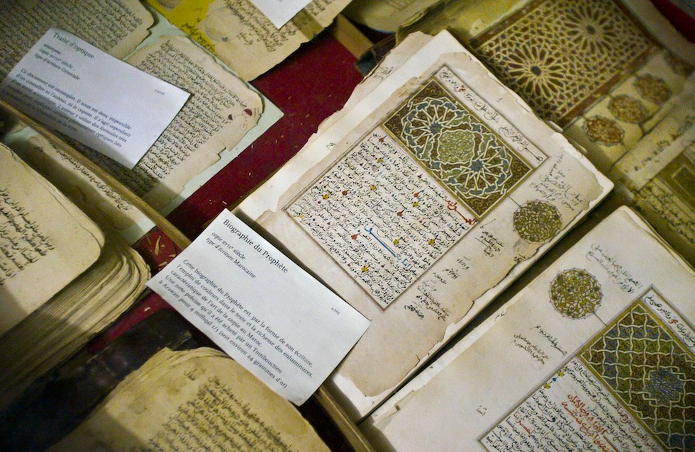 In this photo taken Tuesday, Mar. 16, 2004, some of the 20,000 preserved ancient Islamic manuscripts which rest in air-conditioned rooms are displayed at the Ahmed Baba Institute in Timbuktu, Mali. Islamist extremists torched the library containing the historic manuscripts in Timbuktu, the mayor of the town said Monday, Jan. 28, 2013, while owners have succeeded in removing some of the manuscripts from Timbuktu to save them and others have been carefully hidden away from the Islamists. (AP Photo/Ben Curtis)